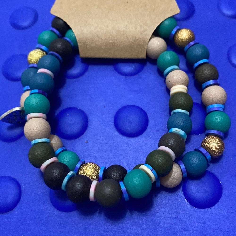 Set of 2 bracelets with wooden beads &clay, spacers,&charm 6 1/2 in water proof